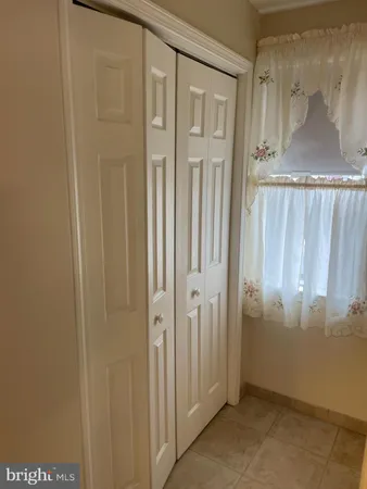 a view of an empty room with a wooden door