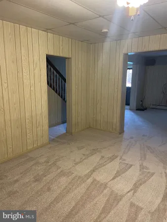 a view of a garage with wooden walls