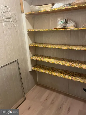 a bathroom with a toilet and a mirror