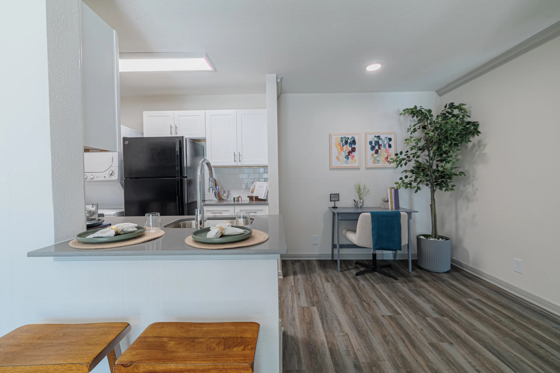 200 Hollow Tree Lane, Unit 20931 Houston, TX 77090 - Photo 5 of 16 a view of a workspace with furniture and wooden floor
