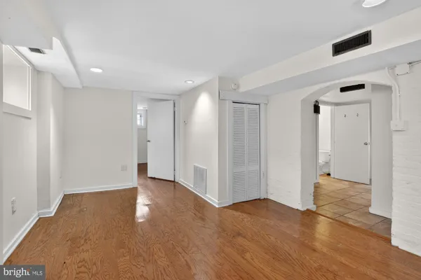 a view of entryway with wooden floor