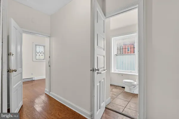 a view of a bathroom from a hallway