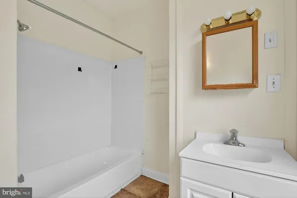 a bathroom with a sink toilet and vanity