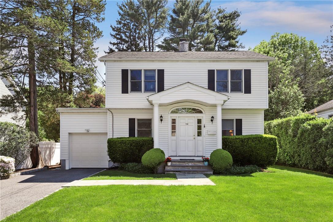 59 Valley Terrace Rye Brook, NY 10573 - Photo 1 of 1 a front view of a house with a garden