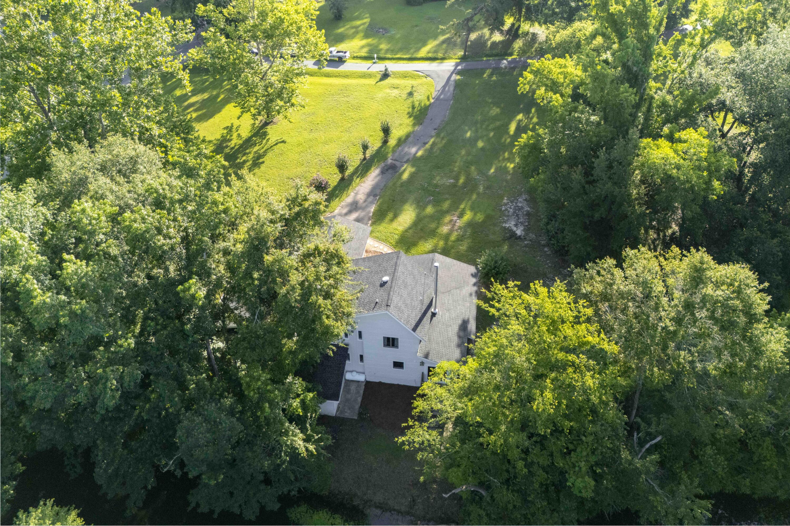 6611 Crooked Creek Road Tallahassee, FL 32311 - Photo 11 of 50 an aerial view of residential houses with outdoor space and trees