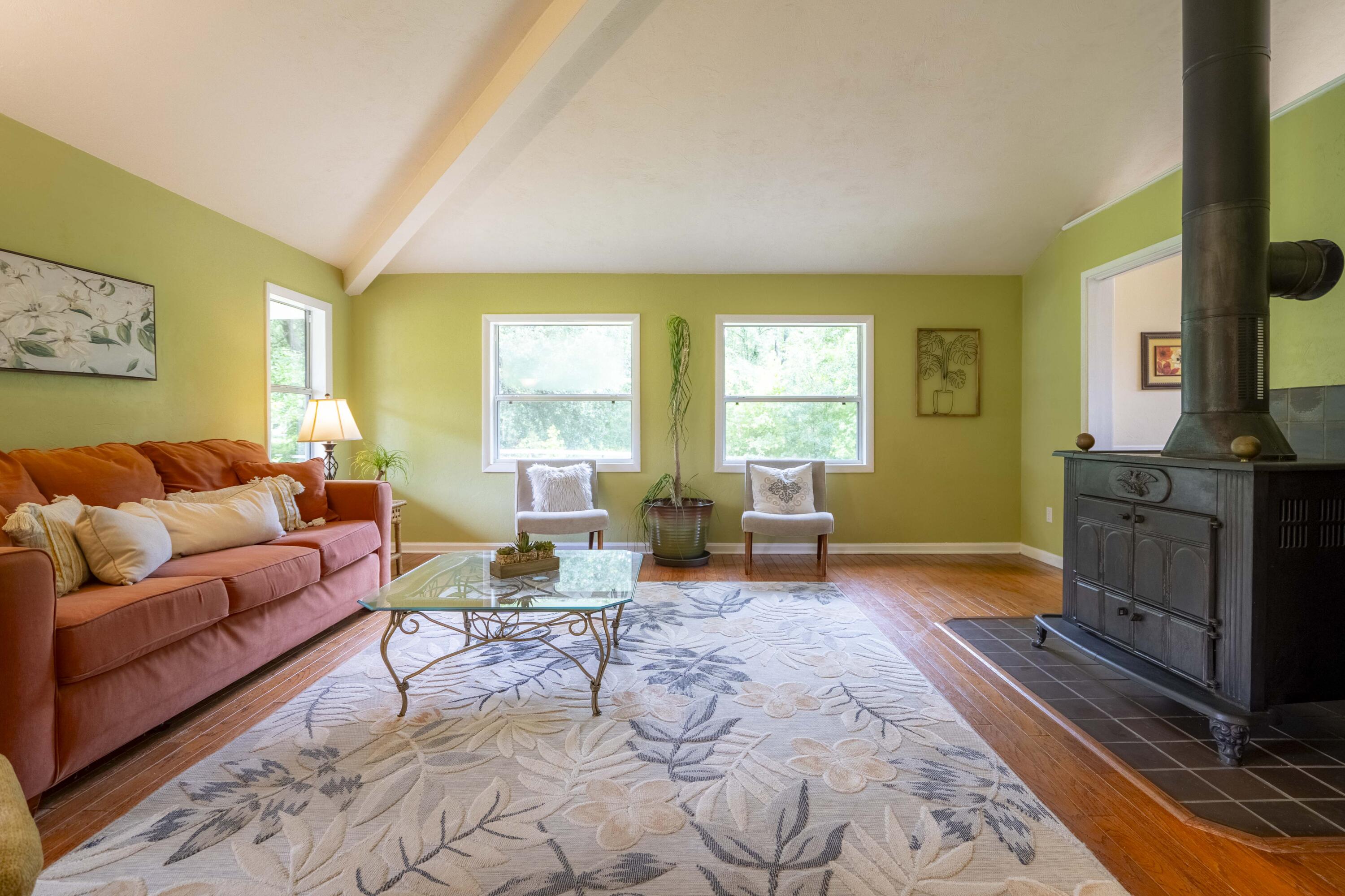 6611 Crooked Creek Road Tallahassee, FL 32311 - Photo 14 of 50 a living room with furniture a fireplace and large windows
