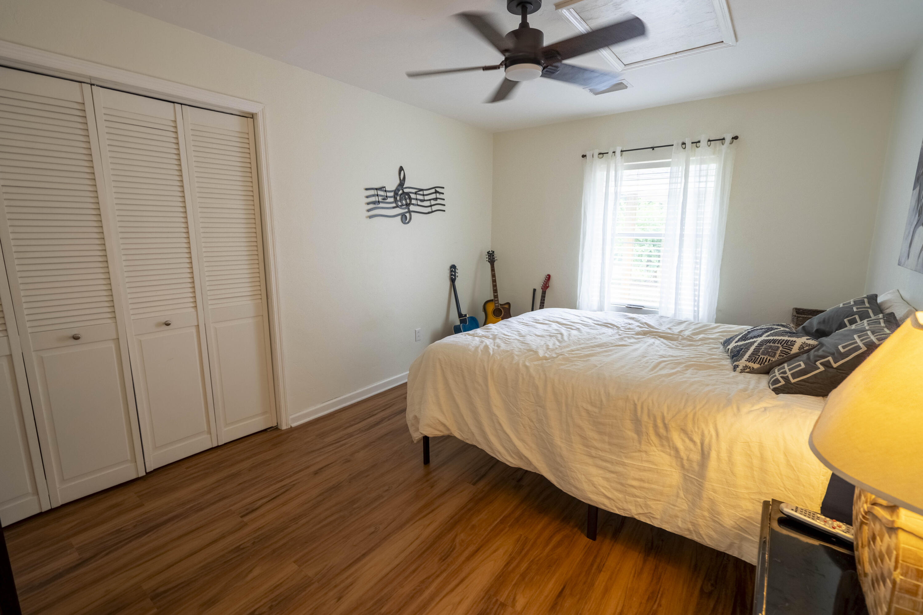 6611 Crooked Creek Road Tallahassee, FL 32311 - Photo 15 of 50 a bedroom with a bed and wooden floor