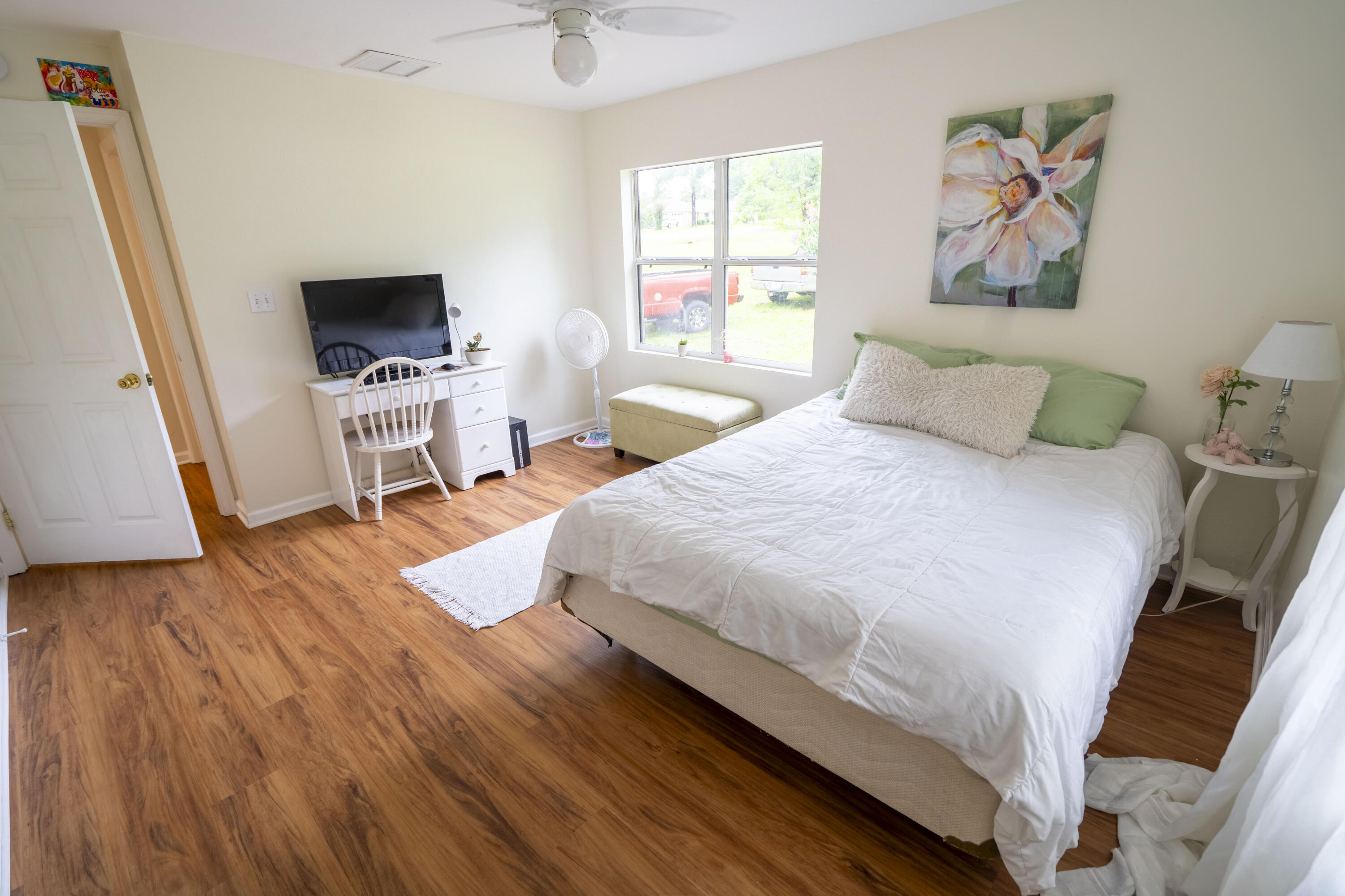 6611 Crooked Creek Road Tallahassee, FL 32311 - Photo 18 of 50 a bedroom with a bed and a flat screen tv