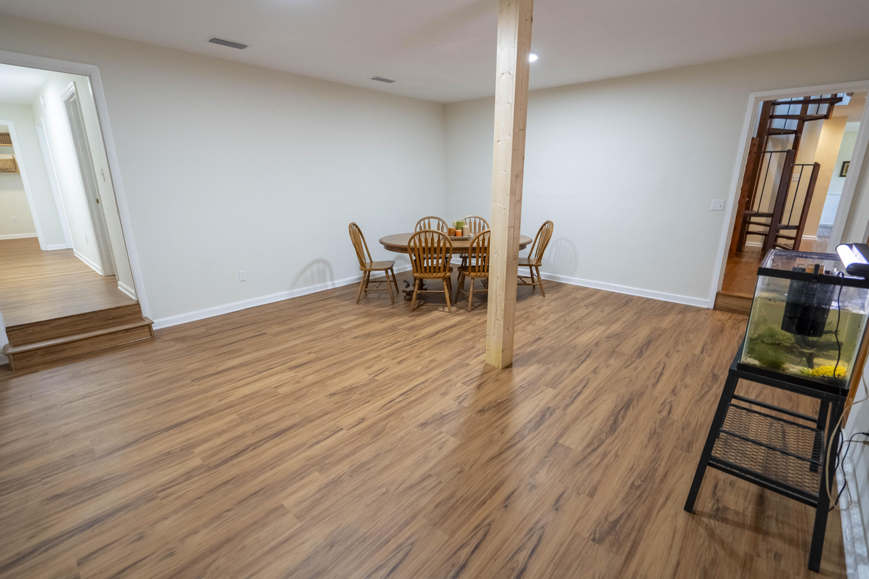 6611 Crooked Creek Road Tallahassee, FL 32311 - Photo 21 of 50 a view of a room with wooden floor and furniture