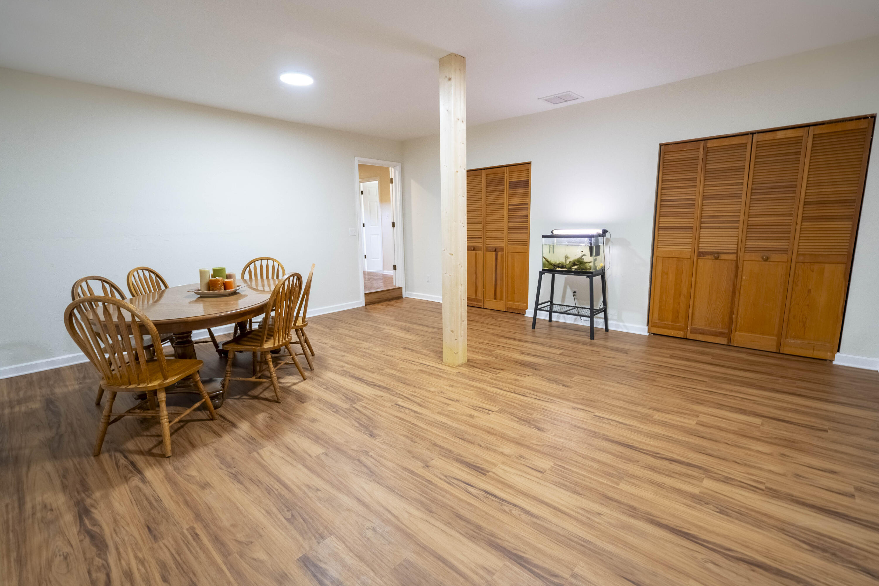 6611 Crooked Creek Road Tallahassee, FL 32311 - Photo 22 of 50 a dining room with furniture and wooden floor