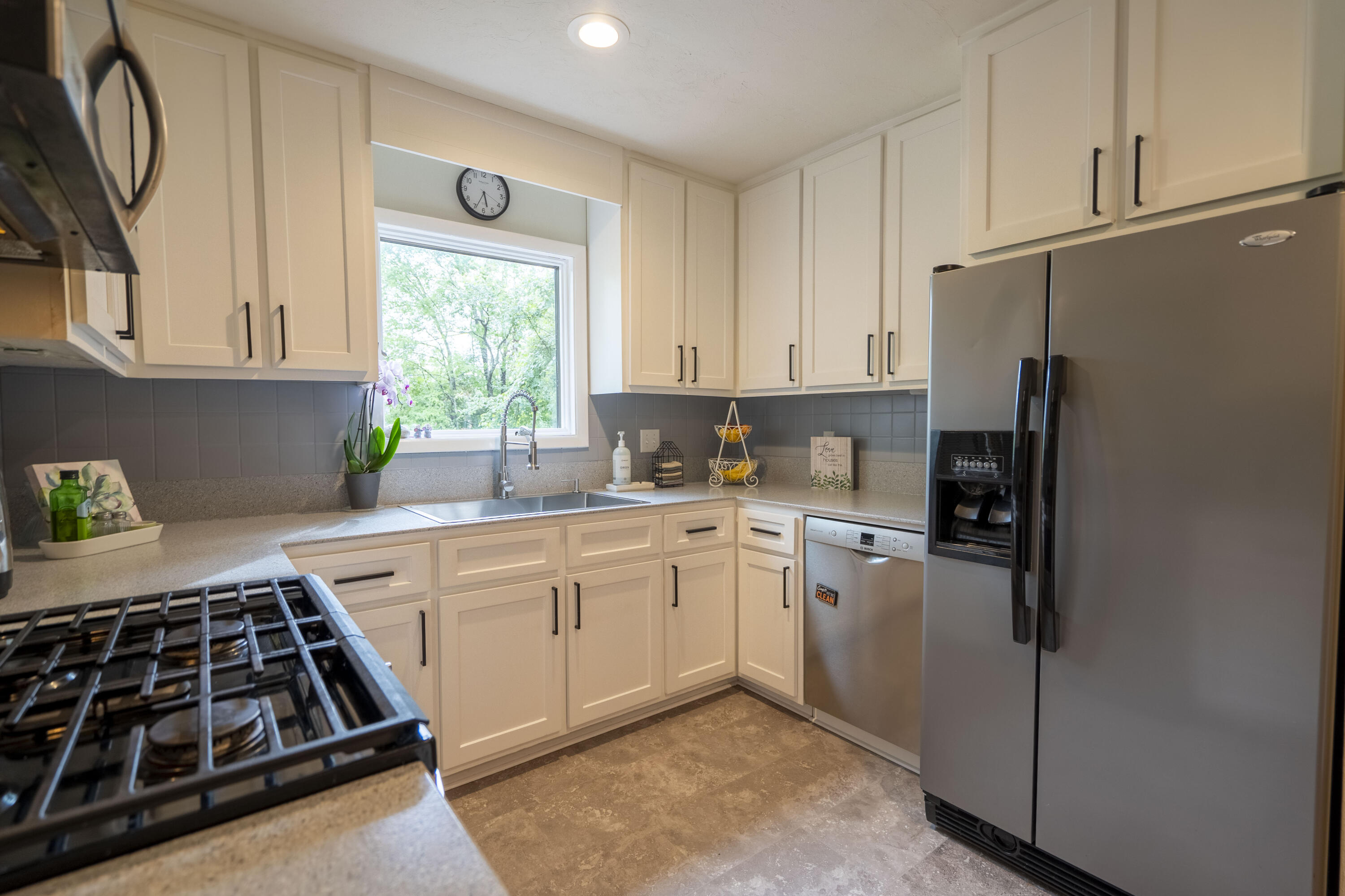 6611 Crooked Creek Road Tallahassee, FL 32311 - Photo 24 of 50 a kitchen with stainless steel appliances granite countertop a refrigerator sink and stove