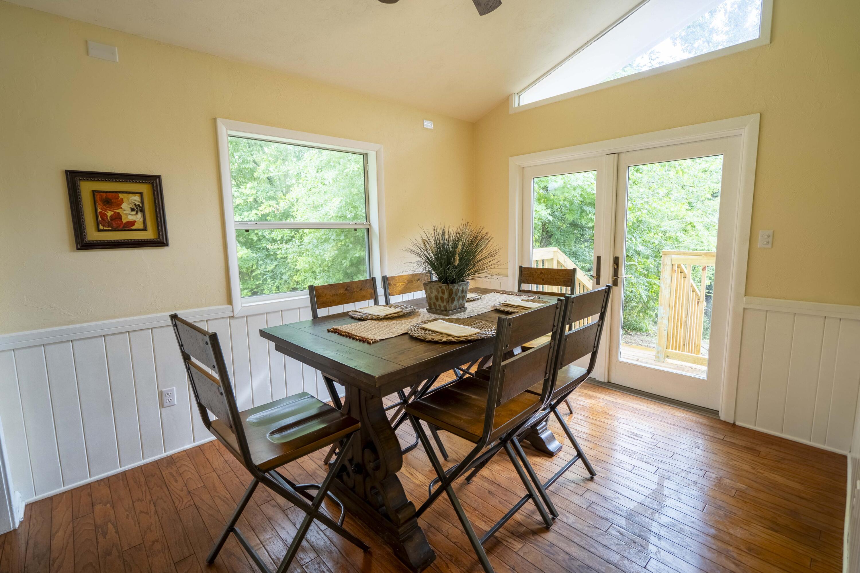 6611 Crooked Creek Road Tallahassee, FL 32311 - Photo 26 of 50 a view of a dining room with furniture window and wooden floor