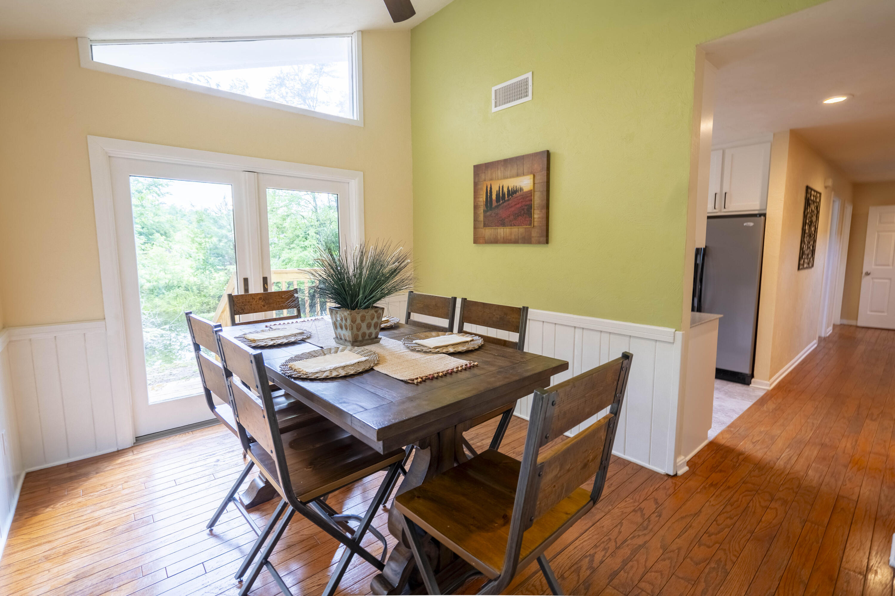 6611 Crooked Creek Road Tallahassee, FL 32311 - Photo 27 of 50 a view of a dining room with furniture and wooden floor