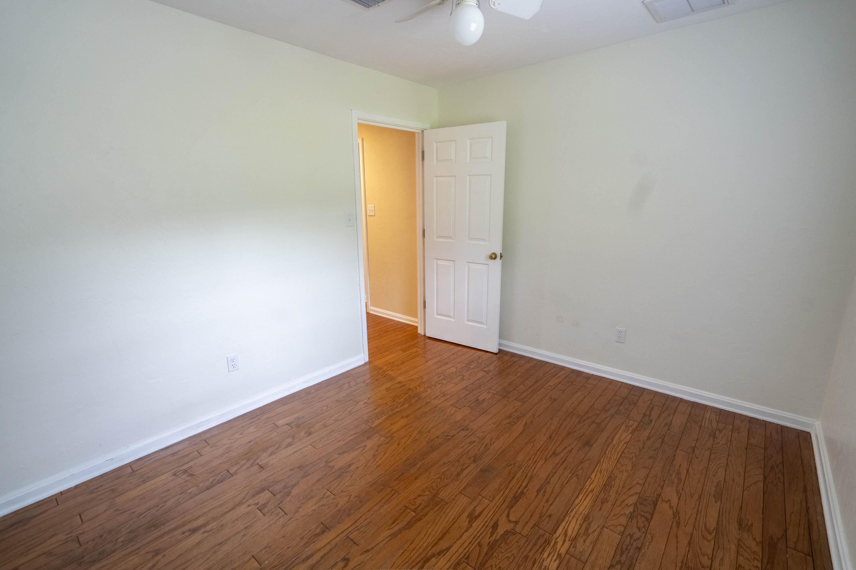 6611 Crooked Creek Road Tallahassee, FL 32311 - Photo 35 of 50 a view of an empty room with wooden floor