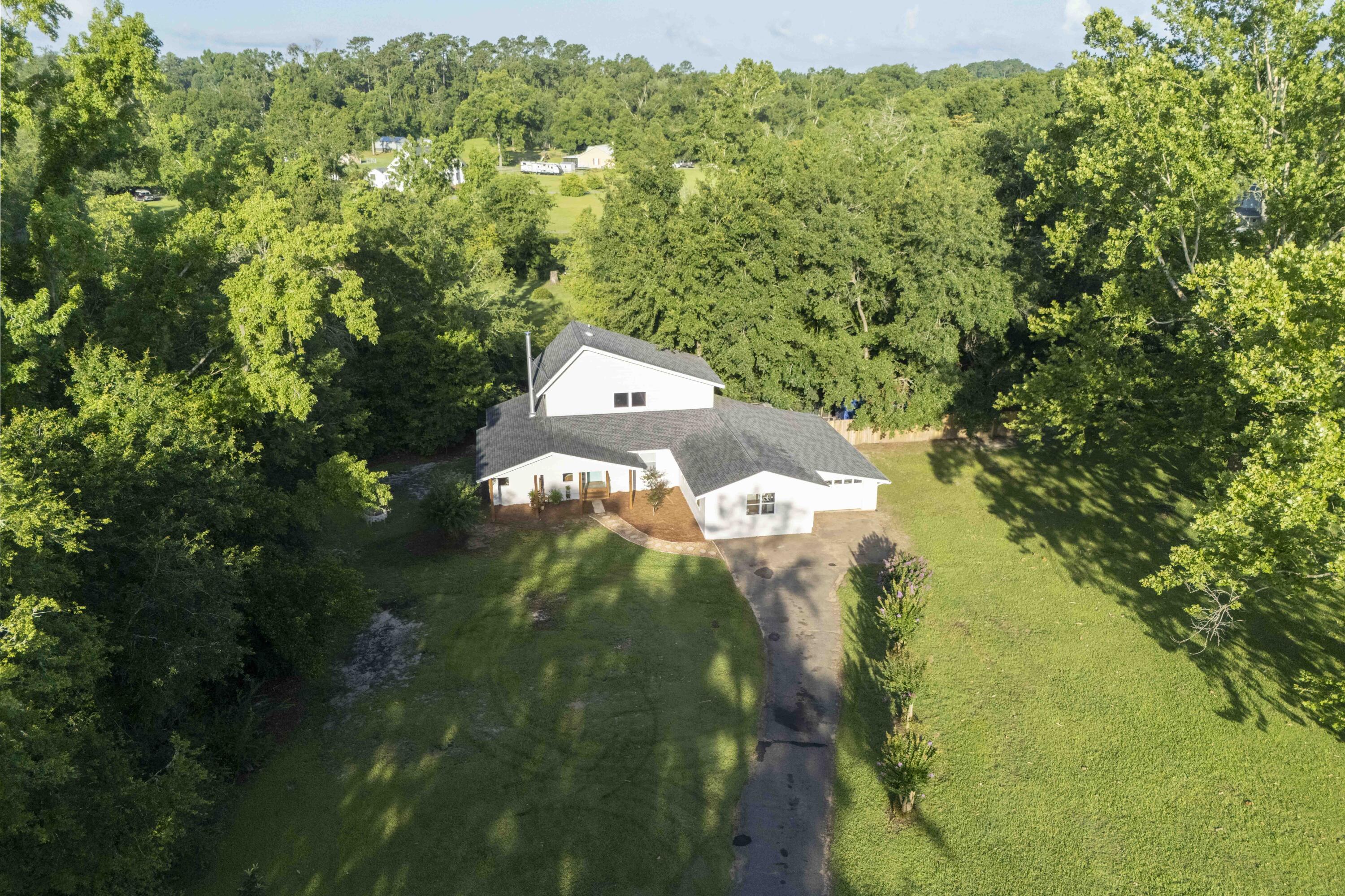 6611 Crooked Creek Road Tallahassee, FL 32311 - Photo 4 of 50 a view of a house with a yard