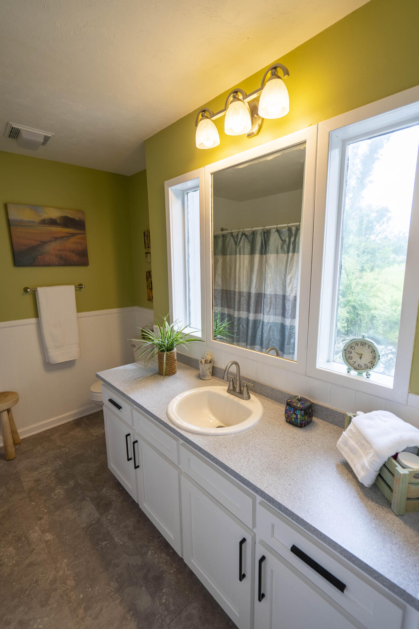6611 Crooked Creek Road Tallahassee, FL 32311 - Photo 46 of 50 a bathroom with a granite countertop sink and a large mirror