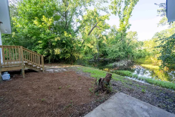 a view of backyard with outdoor and entertaining space