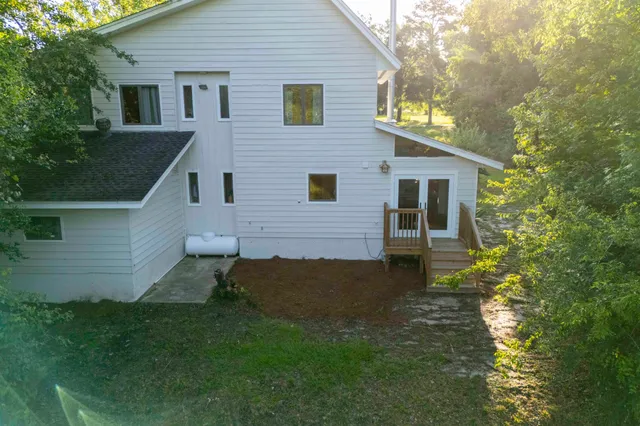 a view of backyard of a house