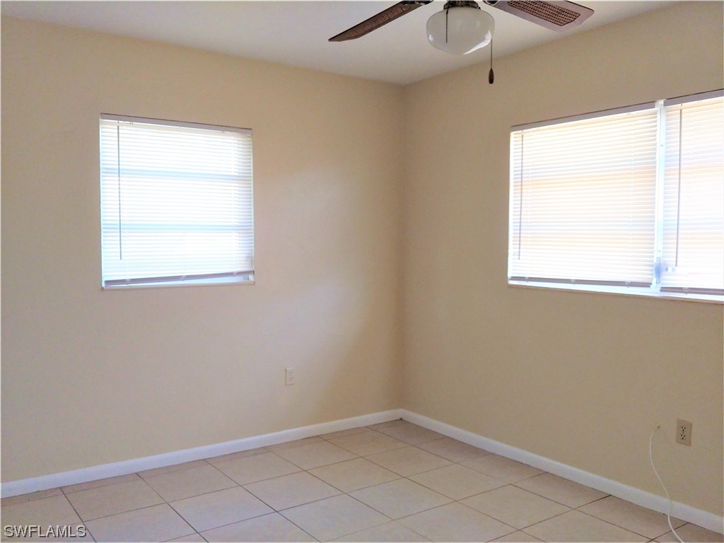 112 Clayton Avenue Lehigh Acres, FL 33936 - Photo 11 of 16 an empty room with a window