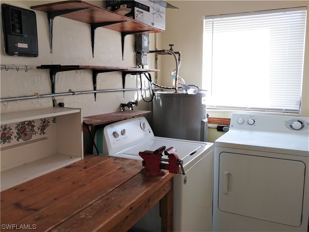 112 Clayton Avenue Lehigh Acres, FL 33936 - Photo 13 of 16 a utility room with dryer and washer