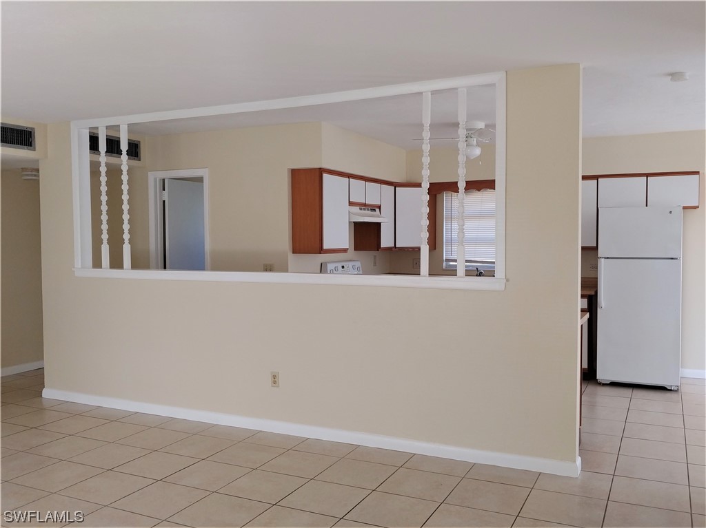 112 Clayton Avenue Lehigh Acres, FL 33936 - Photo 3 of 16 a bathroom with a sink and a mirror