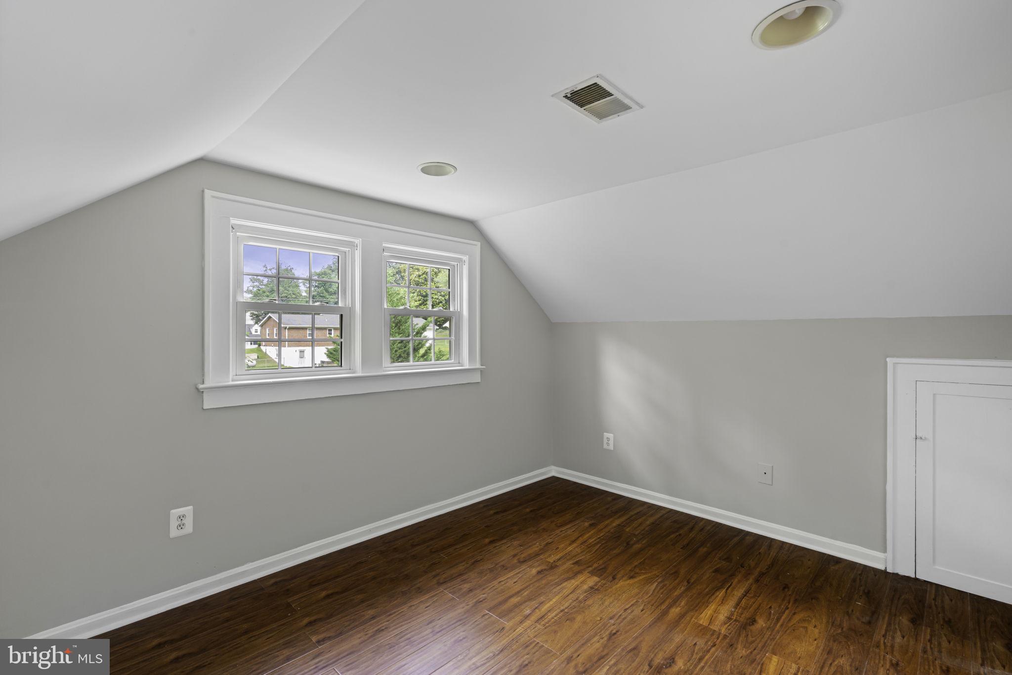 19316 Weaver Road Triangle, VA 22172 - Photo 8 of 33 an empty room with wooden floor and windows
