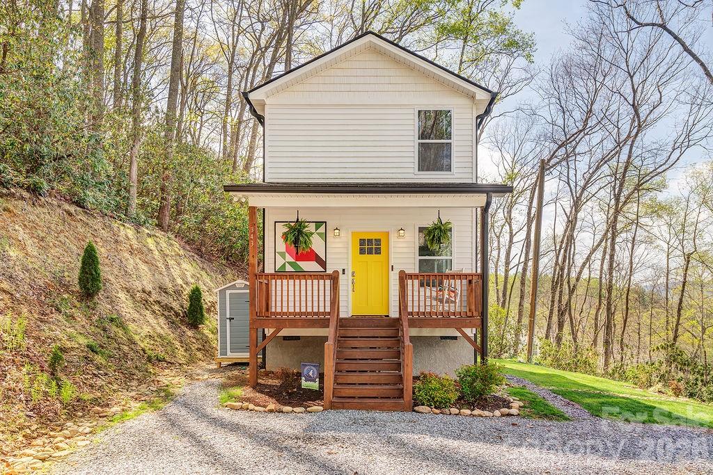 343 Garren Creek Road Fairview, NC 28730 - Photo 1 of 30 a front view of a house with a yard