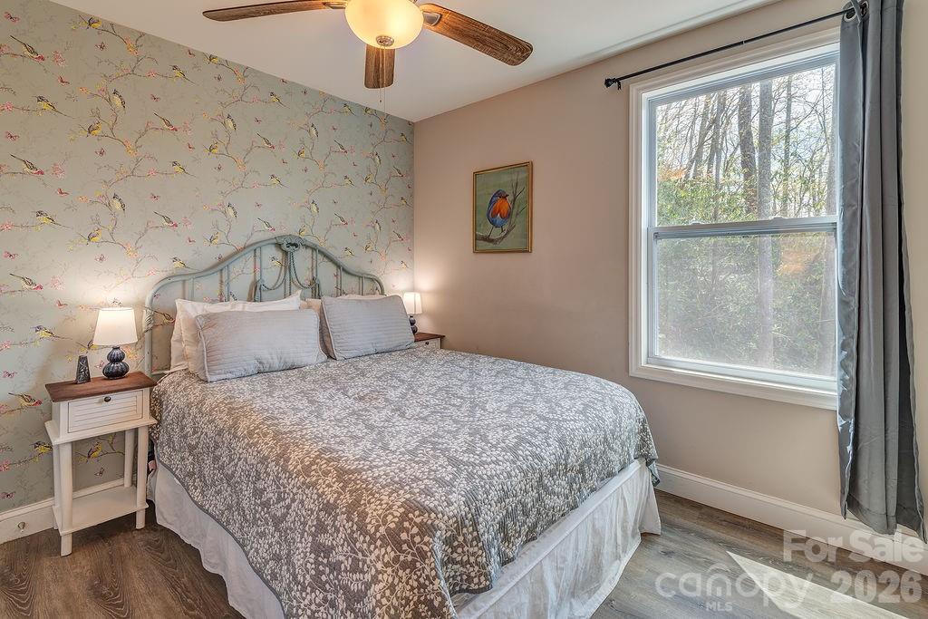 343 Garren Creek Road Fairview, NC 28730 - Photo 22 of 30 a bedroom with a bed and a window