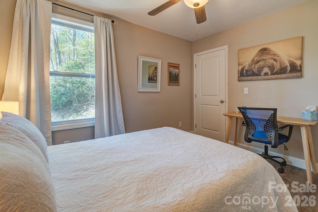 343 Garren Creek Road Fairview, NC 28730 - Photo 26 of 30 a bedroom with bed and a window