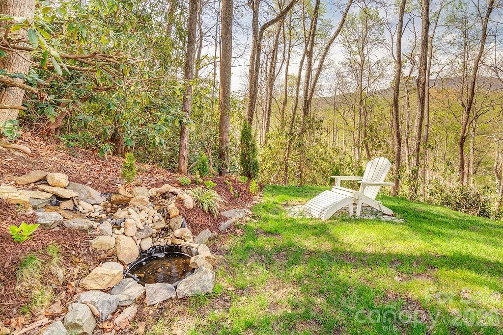 343 Garren Creek Road Fairview, NC 28730 - Photo 29 of 30 a view of yard with swimming pool and sitting area