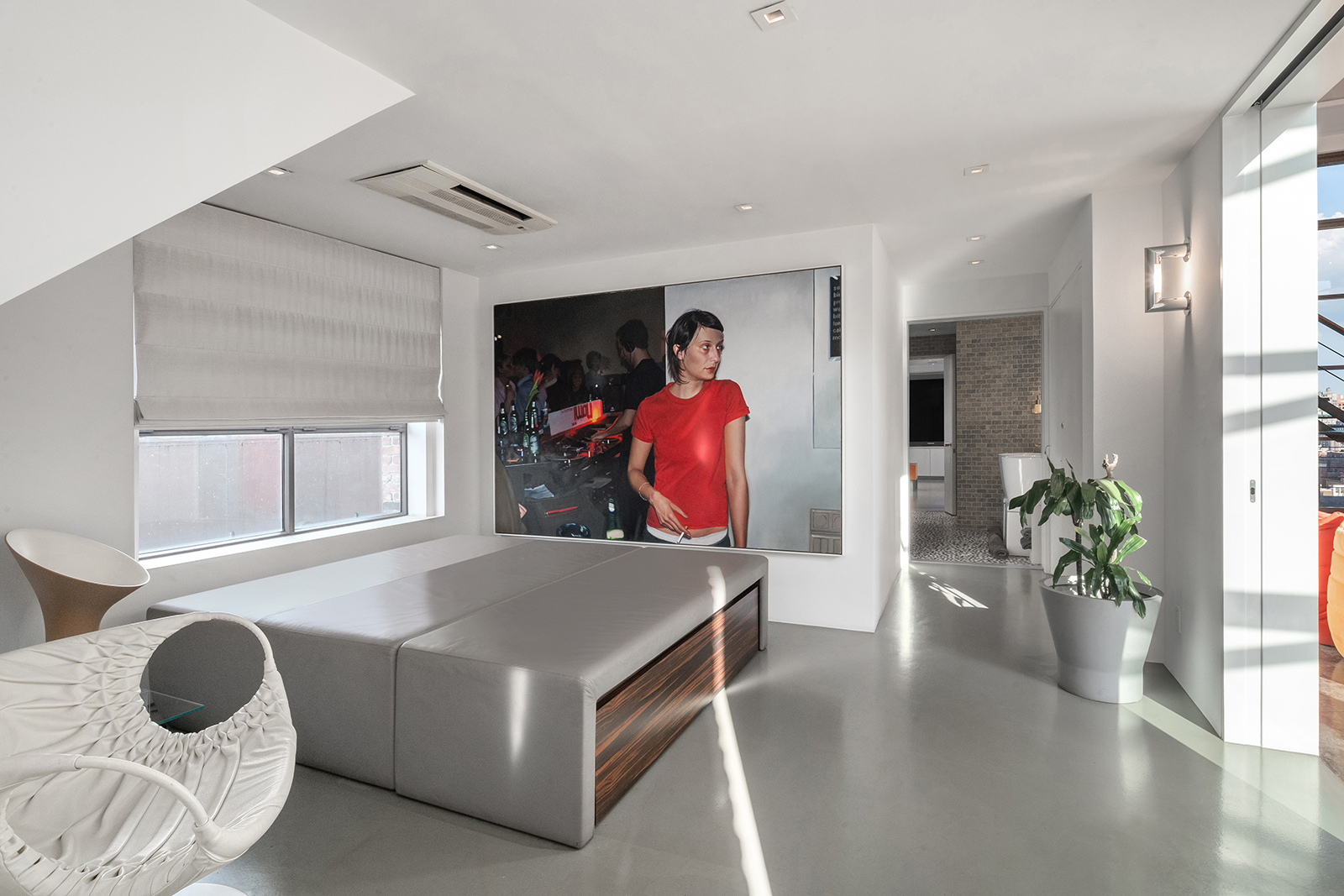 704 Broadway, Unit PH Manhattan, NY 10003 - Photo 11 of 30 a living room with furniture and a potted plant