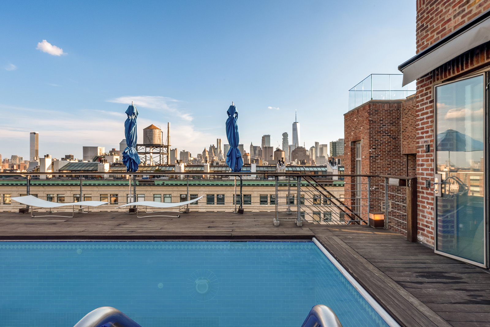 704 Broadway, Unit PH Manhattan, NY 10003 - Photo 6 of 30 a view of swimming pool with outdoor seating and city view