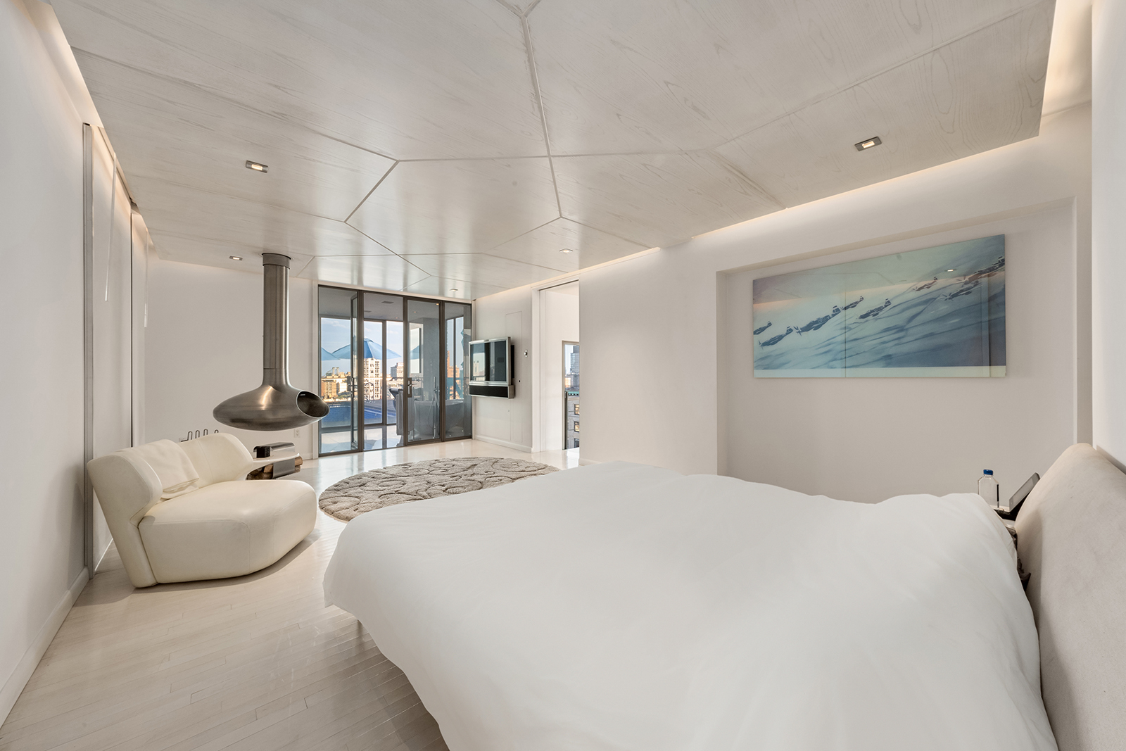 704 Broadway, Unit PH Manhattan, NY 10003 - Photo 7 of 30 a bedroom with a large bed and furniture