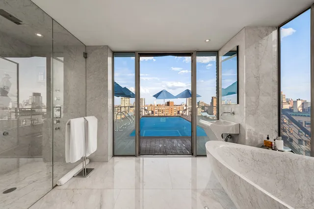 a bedroom with a large bed and furniture