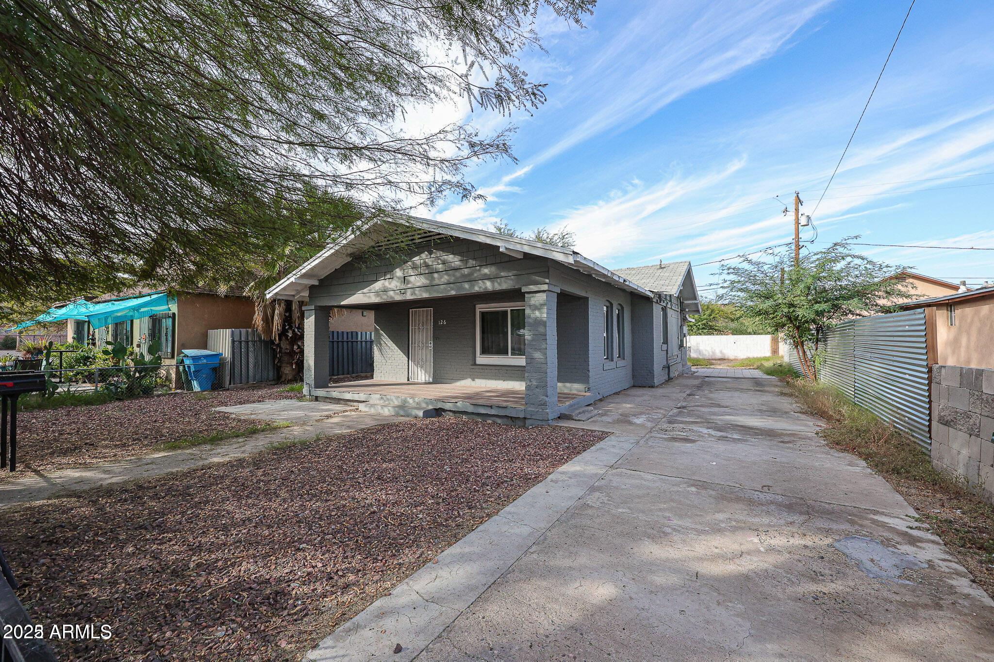 126 North 10th Avenue, Unit 2 Phoenix, AZ 85007 - Photo 20 of 20 a front view of a house with a yard and a garage