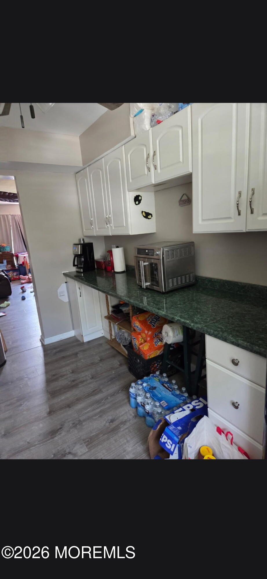 166 Sawmill Road, Unit 563 Brick, NJ 08724 - Photo 8 of 14 a kitchen with stainless steel appliances granite countertop a stove a sink and white cabinets