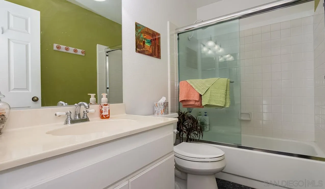 14140 Carmel Ridge Road San Diego, CA 92128 - Photo 13 of 17 a bathroom with a sink a toilet and shower