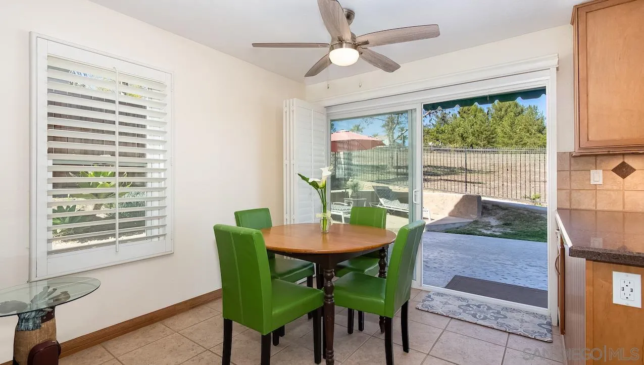 14140 Carmel Ridge Road San Diego, CA 92128 - Photo 4 of 17 a view of a dining room with furniture window and outside view