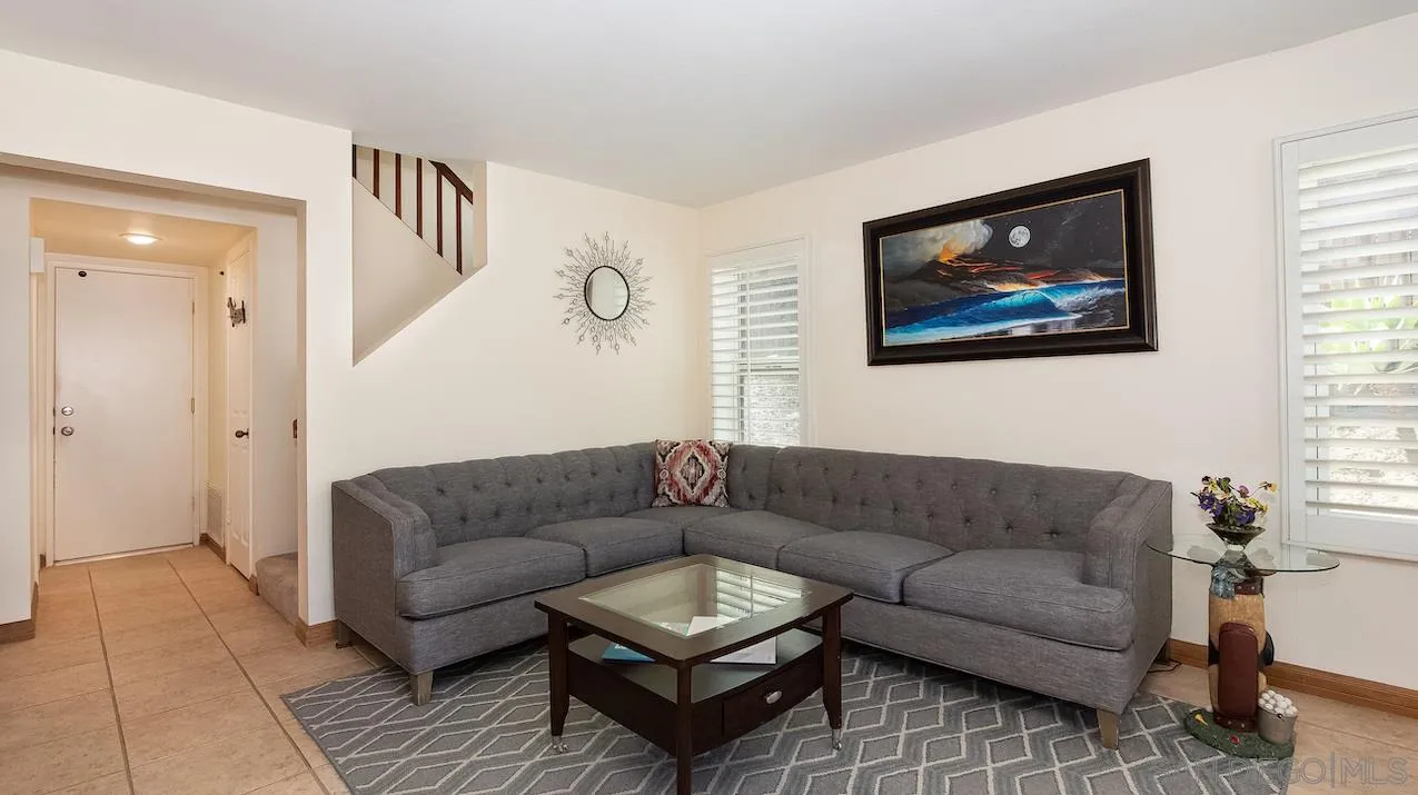 14140 Carmel Ridge Road San Diego, CA 92128 - Photo 6 of 17 a living room with furniture and a couch