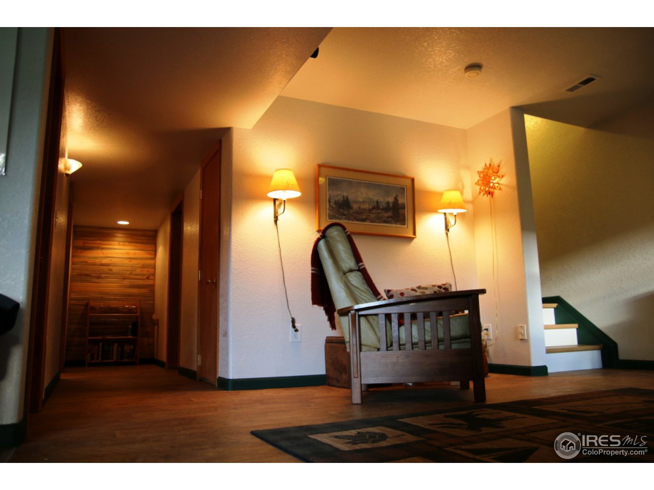 164 Button Rock Road Lyons, CO 80540 - Photo 18 of 23 a view of entryway livingroom and hall with wooden floor