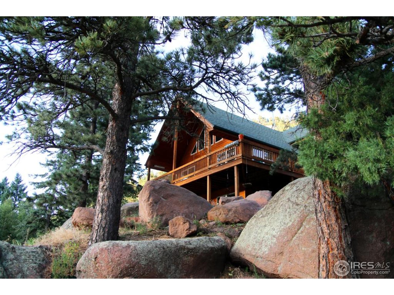 164 Button Rock Road Lyons, CO 80540 - Photo 2 of 23 a view of a house with a tree