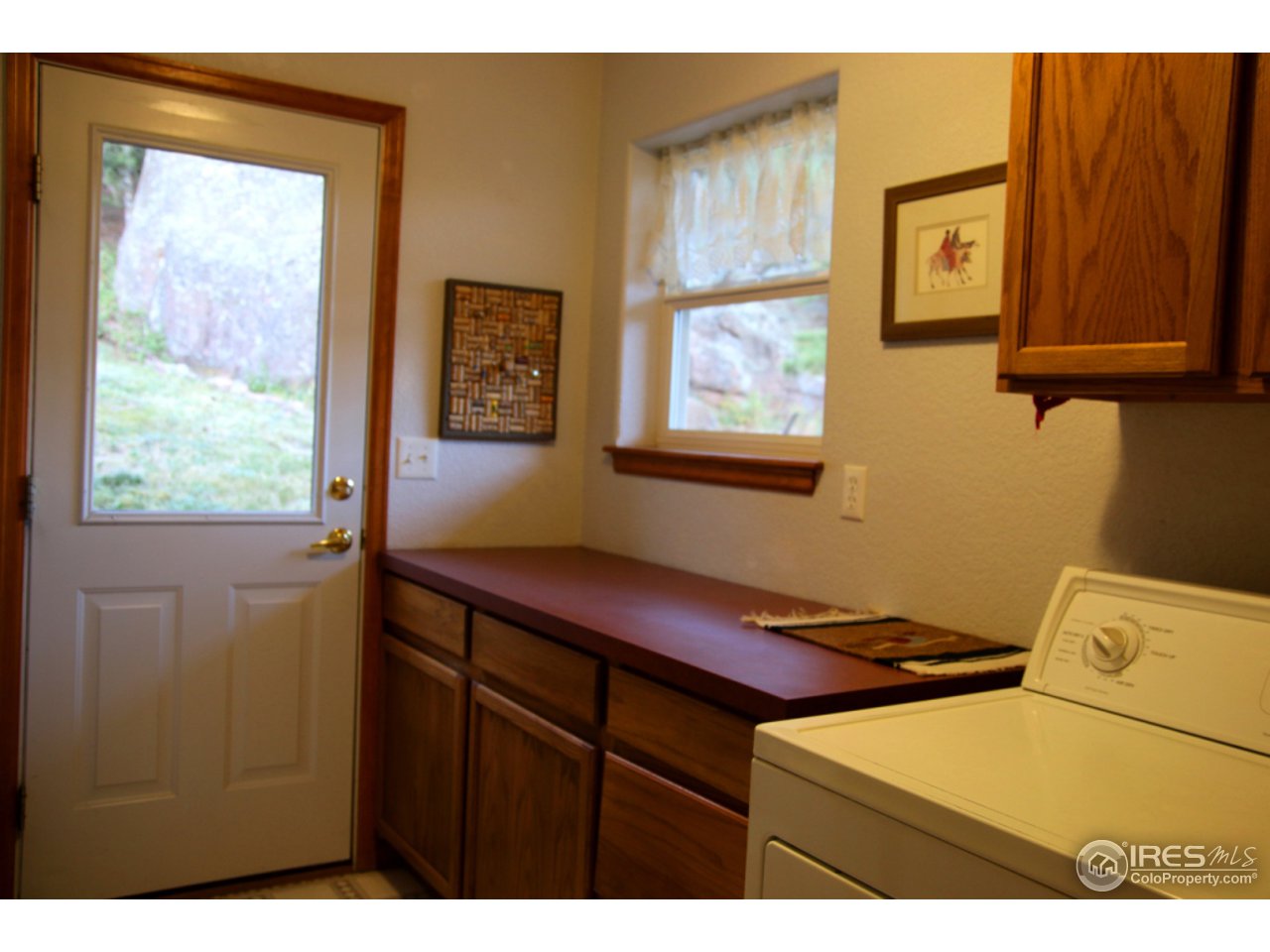 164 Button Rock Road Lyons, CO 80540 - Photo 21 of 23 a bathroom with a sink and a window