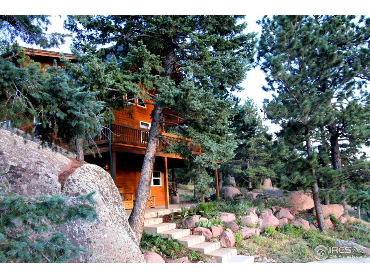 164 Button Rock Road Lyons, CO 80540 - Photo 4 of 23 a view of a house with a yard and garden