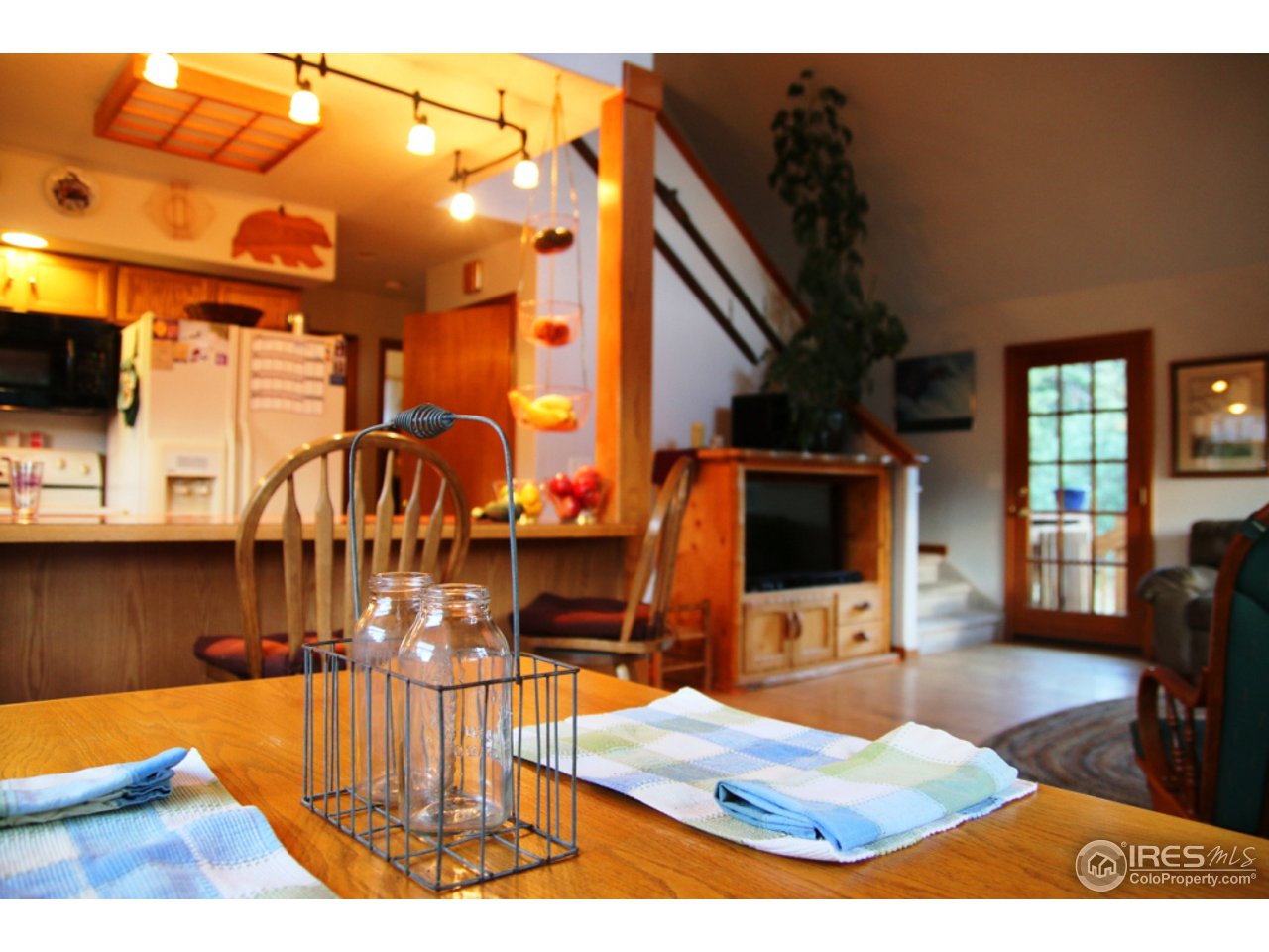 164 Button Rock Road Lyons, CO 80540 - Photo 9 of 23 a view of living room and dining room with furniture