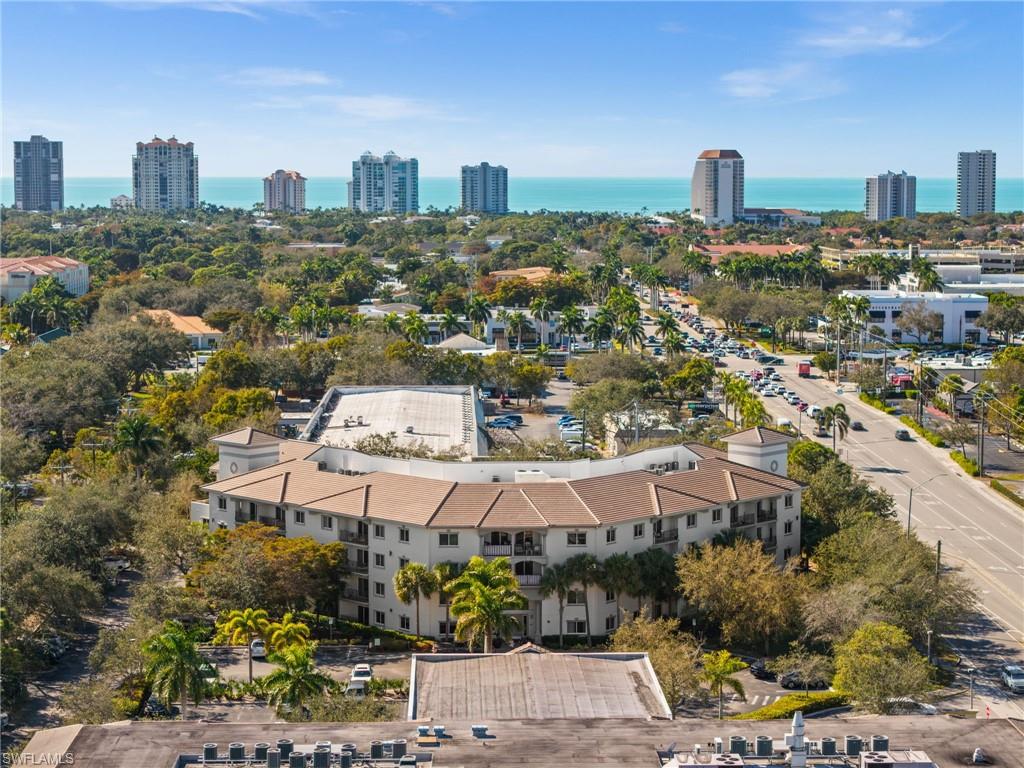1100 Pine Ridge Road, Unit B103 Naples, FL 34108 - Photo 31 of 38 a view of a city with tall buildings