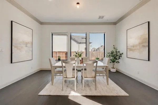 a view of a dining room with furniture and window