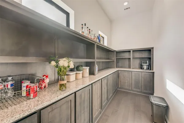 a kitchen with sink cabinets and window