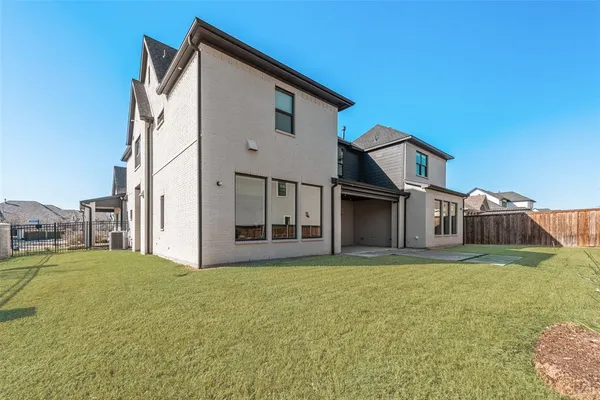 a view of a house with a yard and garage