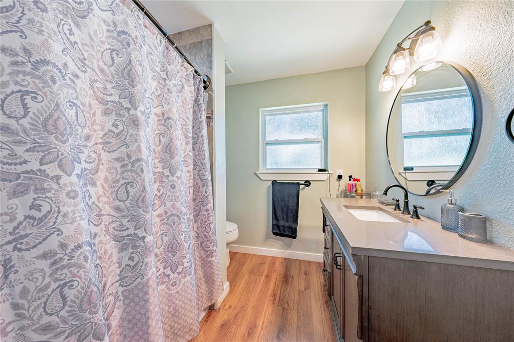 603 Mosley Road Athens, TX 75751 - Photo 9 of 15 a spacious bathroom with a sink and a mirror