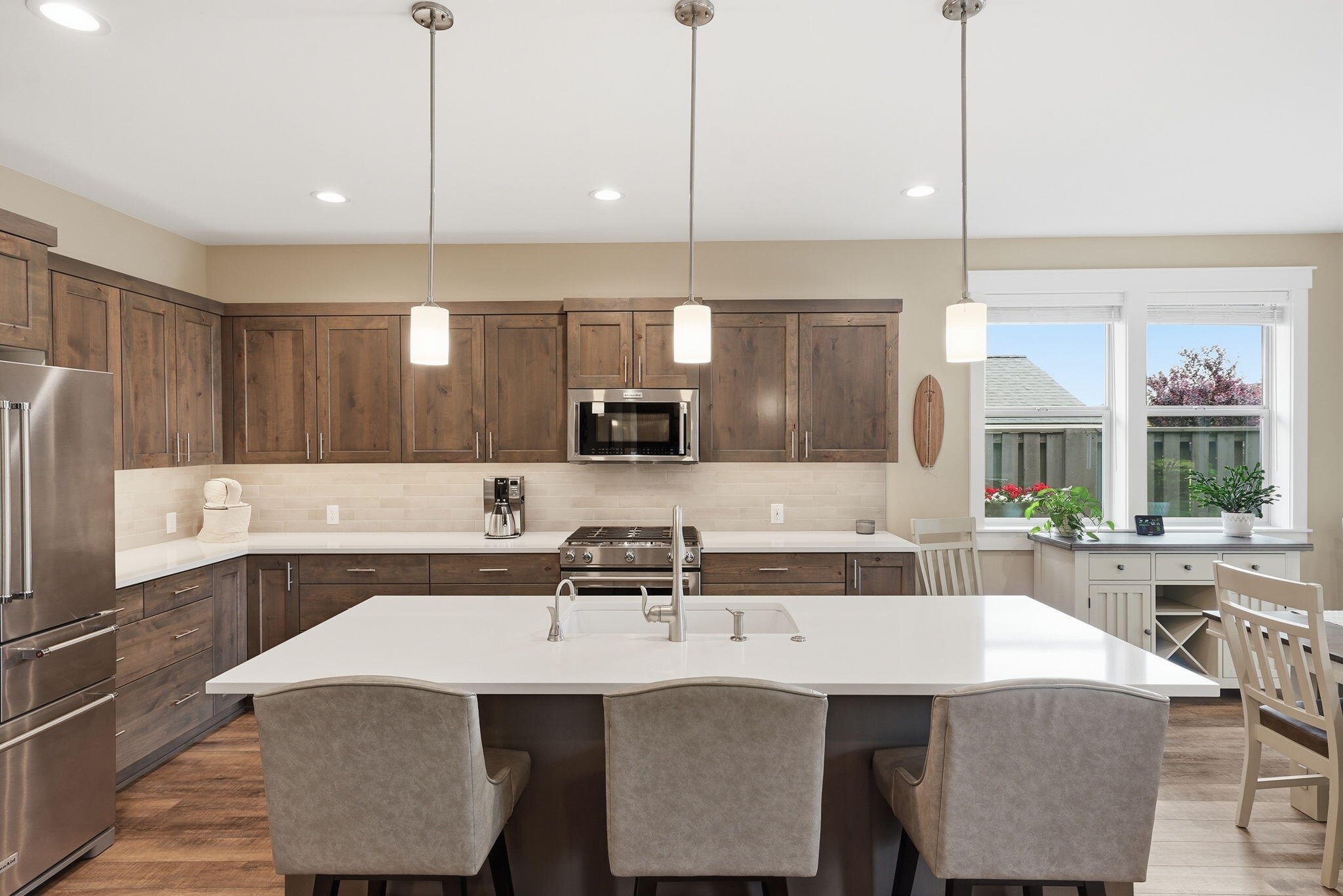 2714 Northwest 23rd Street Redmond, OR 97756 - Photo 10 of 57 a kitchen with a sink a counter space appliances and cabinets